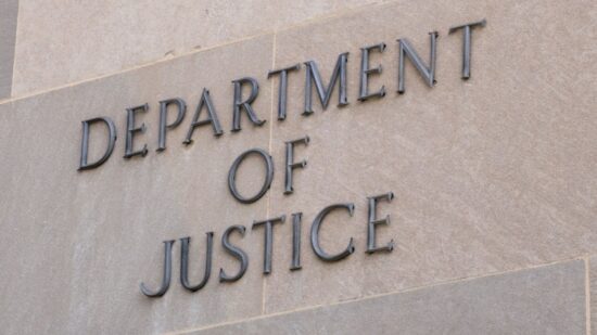 Sign at the United States Department of Justice DOJ in Washington, DC-Shutterstock_2262073553
